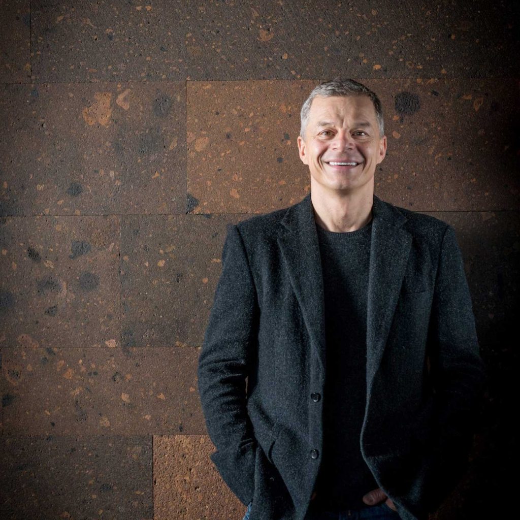 Rainer Becker standing and smiling